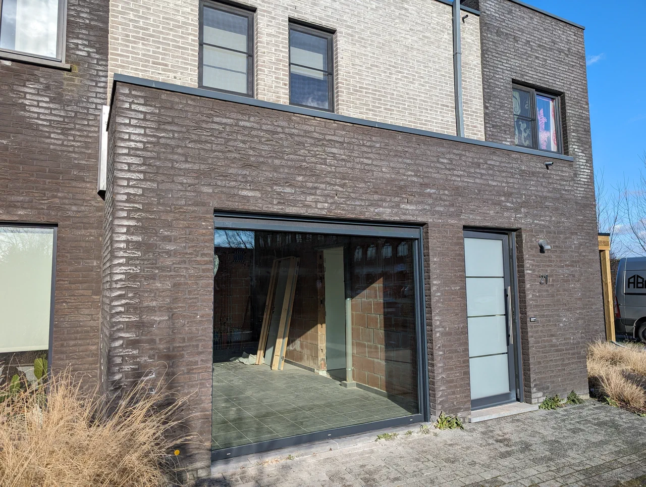 Front facade of house with large window