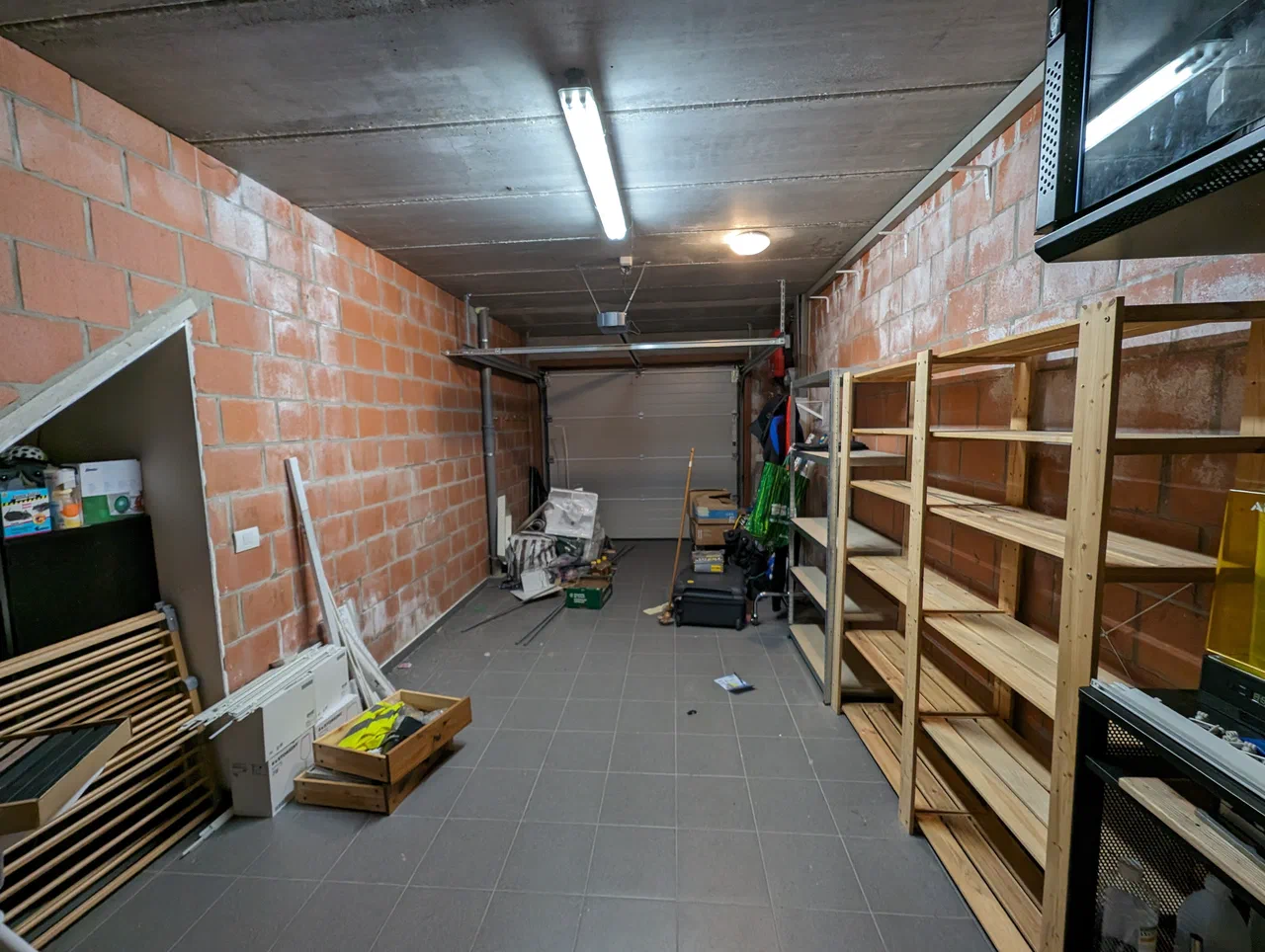 Same interior, looking at the sectional garage door